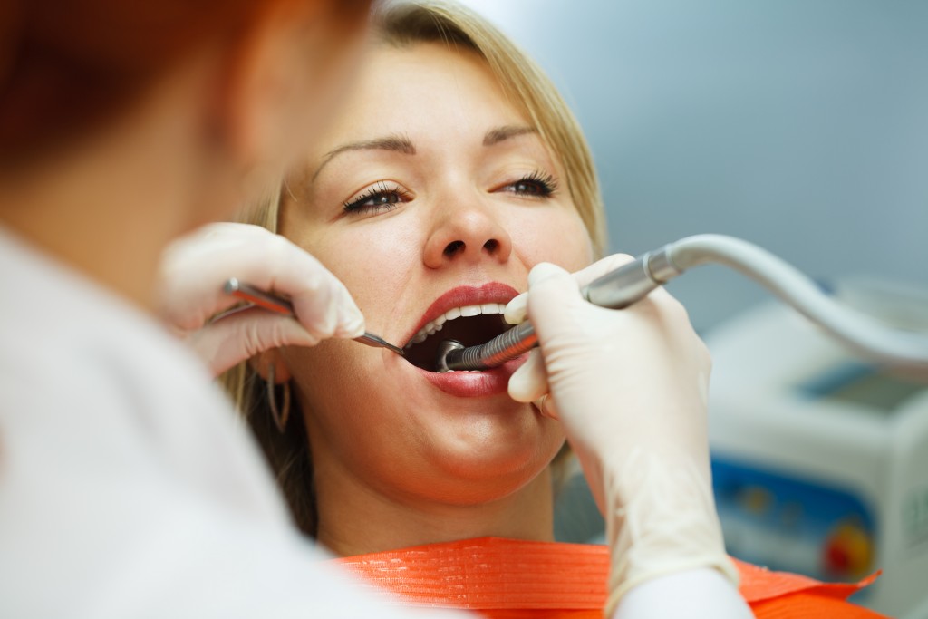 woman getting a dental treatment