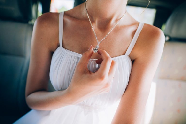 woman holding her pendant